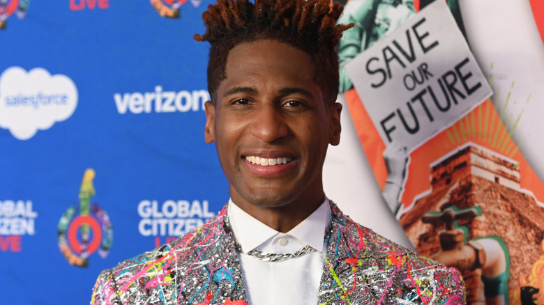 Jon Batiste smiling at an event
