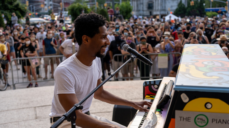 Jon Batiste performing for crowd