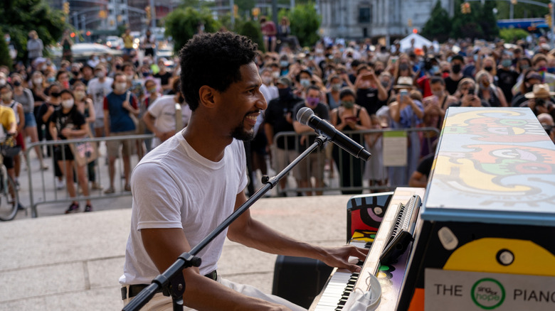 Jon Batiste performing for crowd