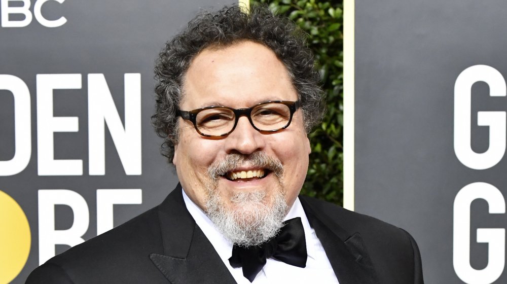 Jon Favreau smiling in a black tuxedo