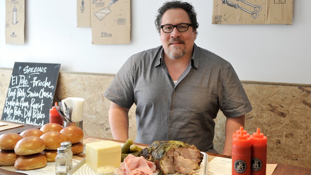 Jon Favreau in front of food
