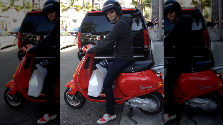 Jordan Schlansky on red vespa