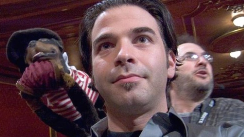 Jordan Schlansky, Triumph the Insult Comic Dog, and Robert Smigel on set 