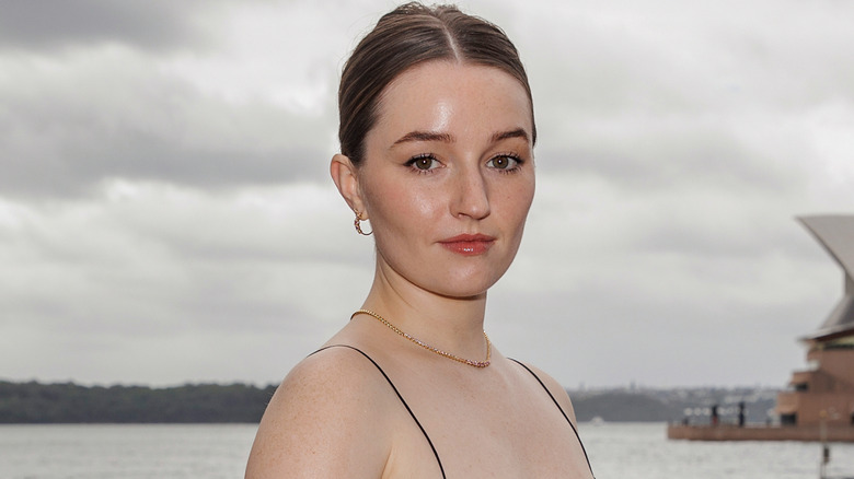 Kaitlyn Dever posing in front of the Sydney Opera House