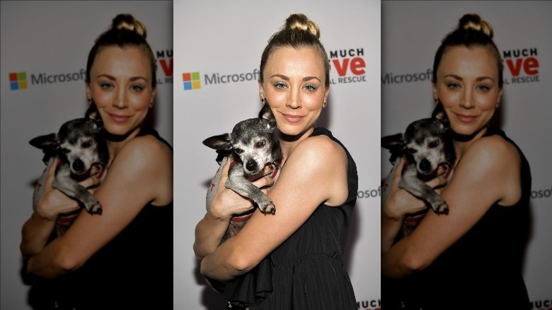 Kaley Cuoco holding a dog