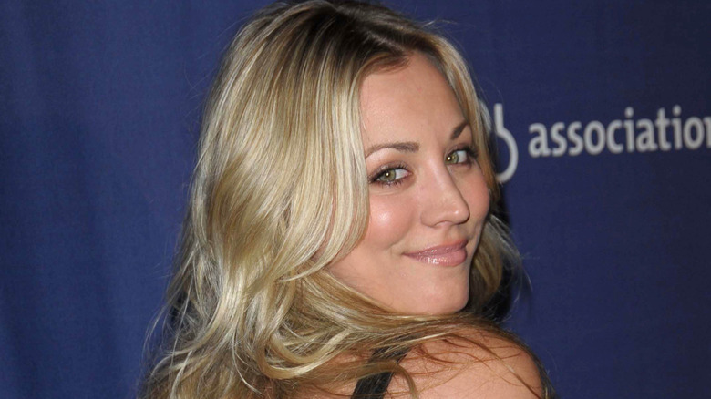 Kaley Cuoco looking over her shoulder