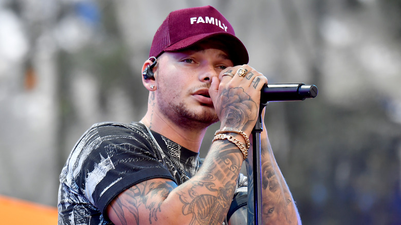 Kane Brown holding microphone