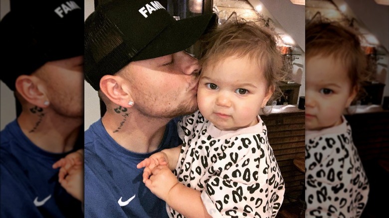 Kane Brown kissing his baby 