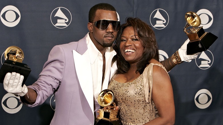 Kanye West and mom Dr. Donda West holding Grammys
