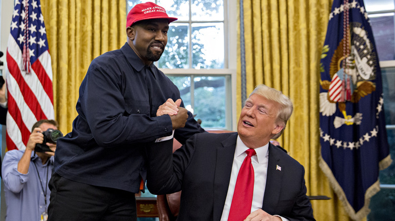 Kanye West shaking hands with Donald Trump