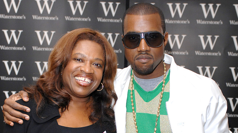 Kanye West with his arm around Dr. Donda West