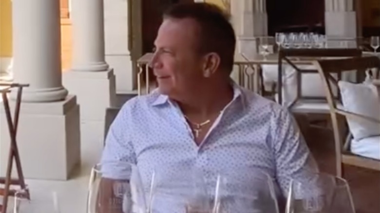 Nicholas Riccio sitting down at a dinner table
