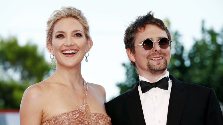 Actress Kate Hudson and singer Matt Bellamy, posing