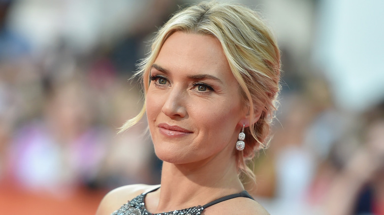 Kate Winslet in a sleeveless dress, posing