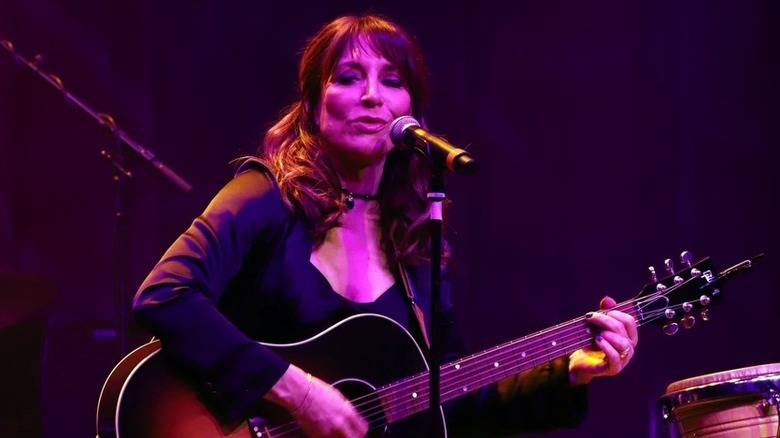 Katey Sagal sings and strums guitar