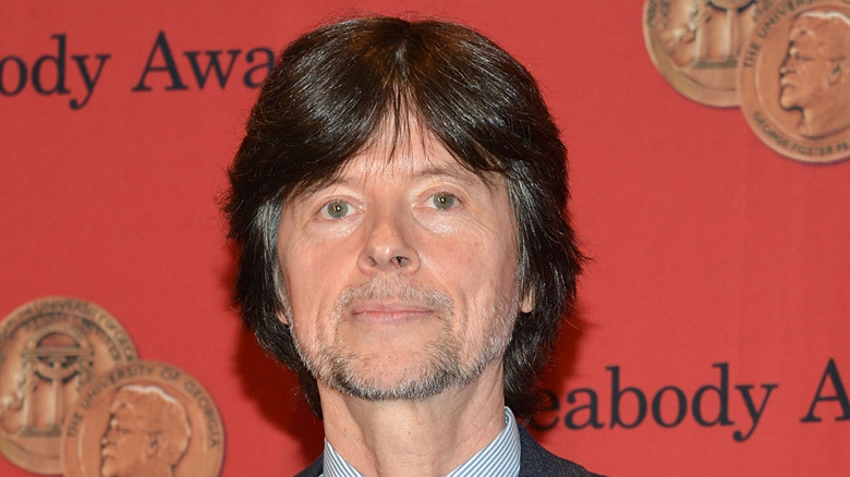Ken Burns holding an award