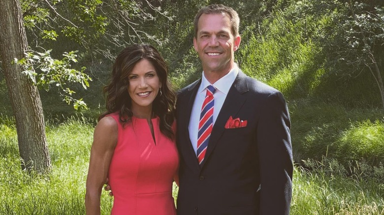 Bryon and Kristi Noem posing for cameras