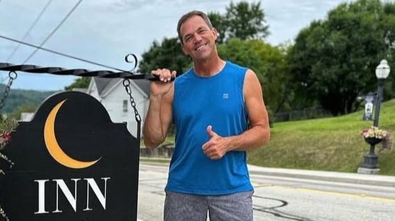 Bryon Noem posing outside inn