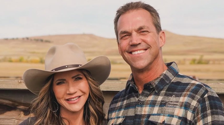Kristi and Bryon Noem posing for cameras at ranch