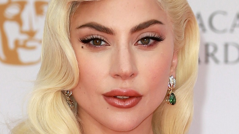 Lady Gaga wearing emerald earrings