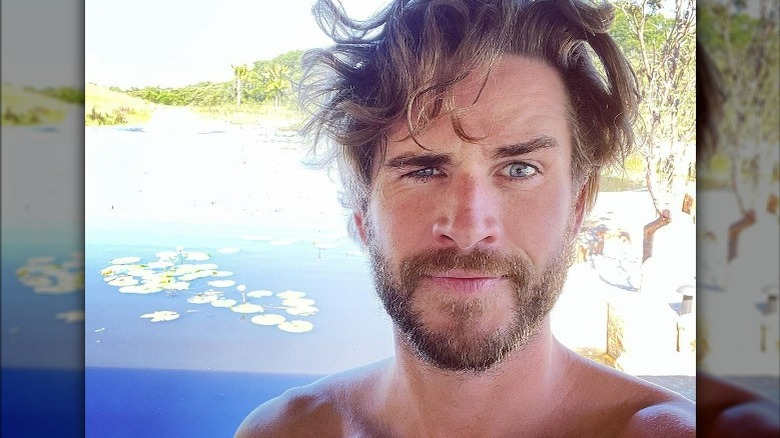 Liam Hemsworth raising eyebrow
