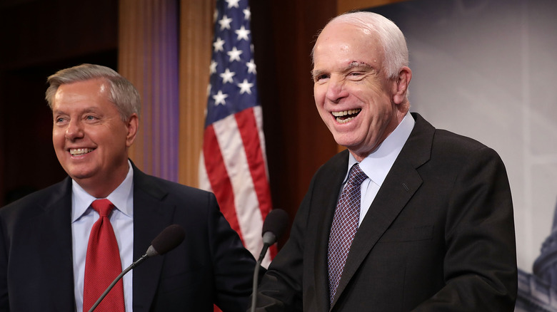Lindsey Graham laughing with John McCain