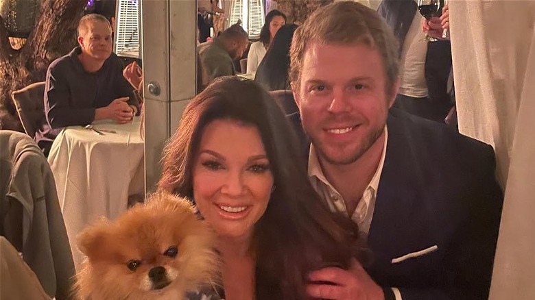 Lisa Vanderpum and Max Todd posing at a restaurant