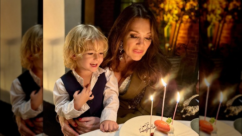 Lisa Vanderpump helping grandson blow out candles on birthday cake