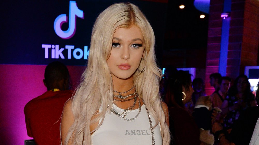 Loren Gray in a white tank top, attending a TikTok event