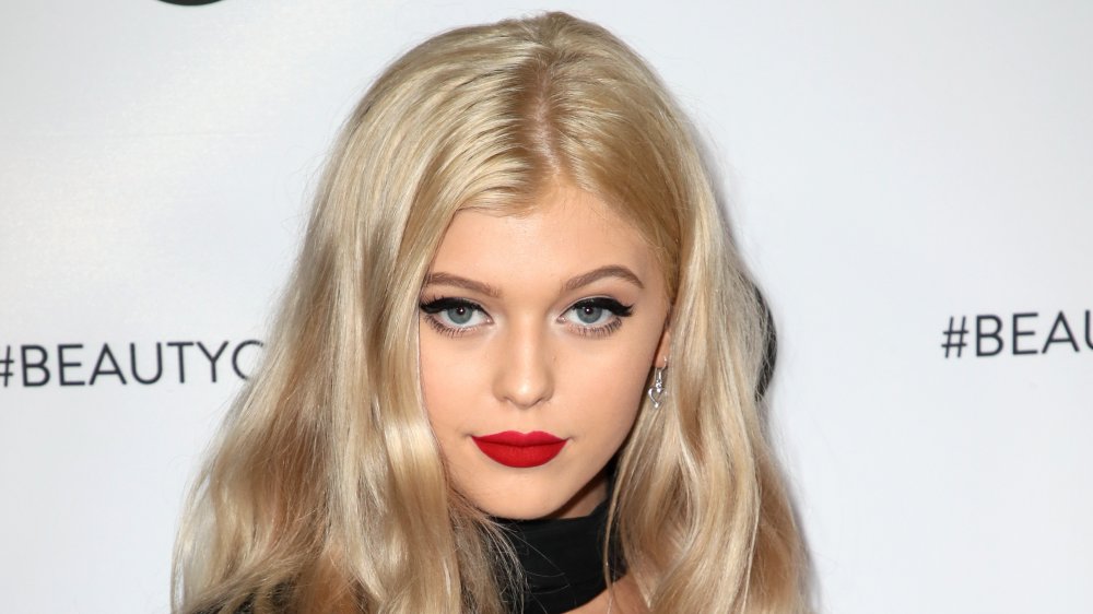 Loren Gray in a white patterned top and black jacket
