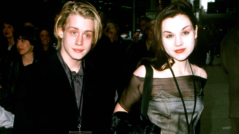 Macaulay Culkin and Rachel Miner posing 
