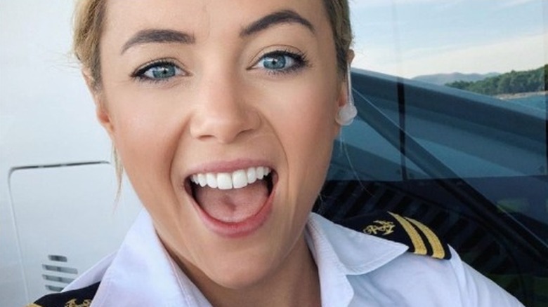 Malia White smiling in uniform