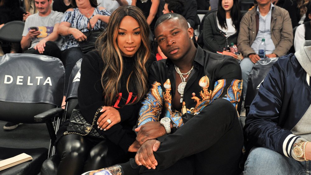Malika Haqq and O.T. Genasis seated at an event