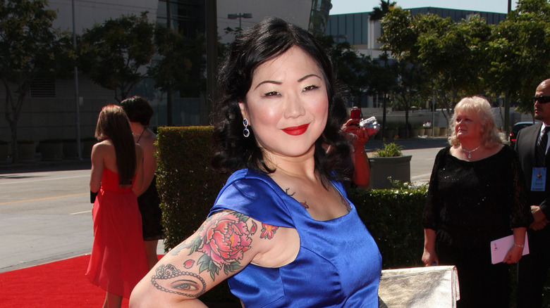 Margaret Cho smiling in blue dress