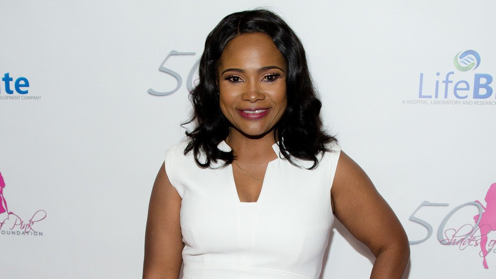Dr. Heavenly Kimes smiling in a white outfit