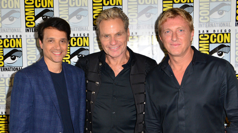 Ralph Maccio, Martin Kove, and William Zabka smiling