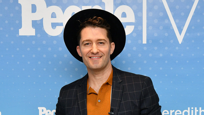 Matthew Morrison wearing a hat