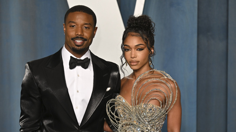 Michael B. Jordan and Lori Harvey at the 2022 Vanity Fair Oscar Party, posing