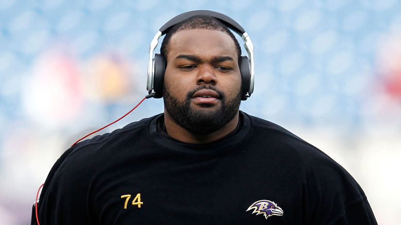 Michael Oher wearing headphones