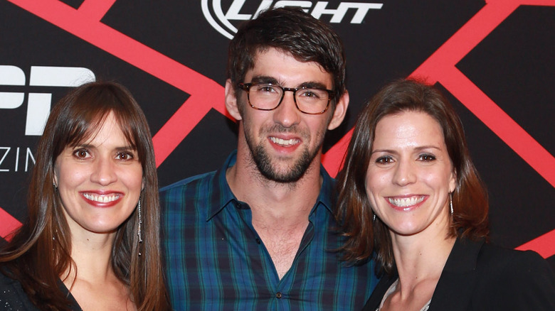 Hilary, Michael, and Whitney Phelps posing