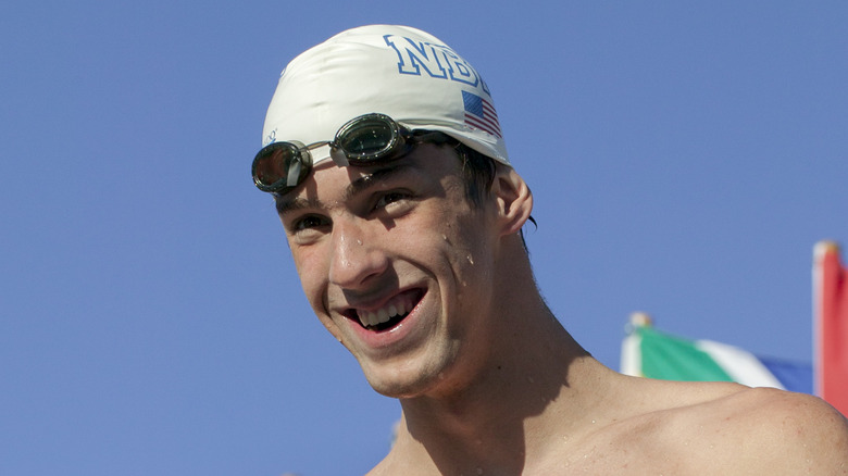 Michael Phelps outside in a swim cap