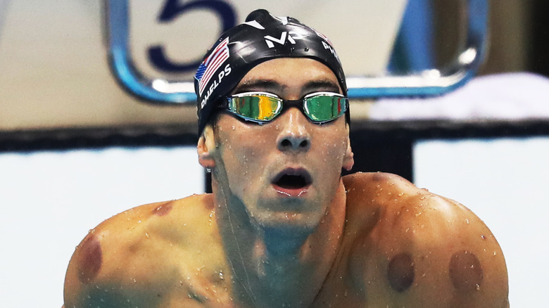 Michael Phelps with a cap and goggles