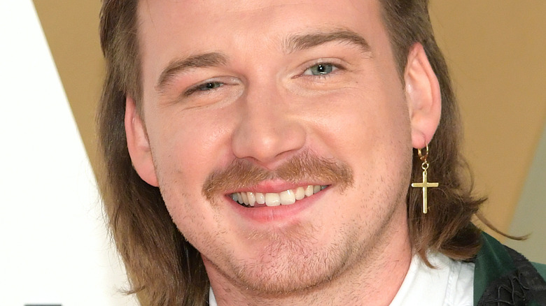 Morgan Wallen wearing a green suit