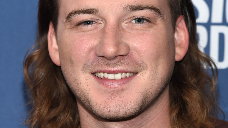 Morgan Wallen in a brown shirt
