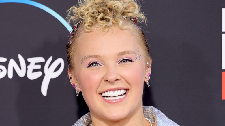 Jojo Siwa on red carpet, smiling
