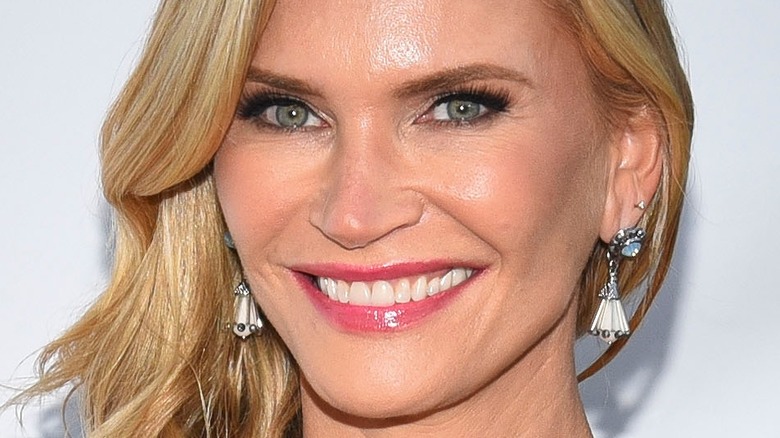 Natasha Henstridge smiling on red carpet