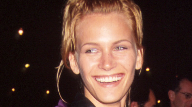 Natasha Henstridge smiling on red carpet