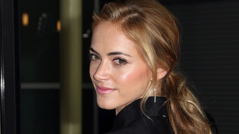 Emily Wickersham looking over her shoulder