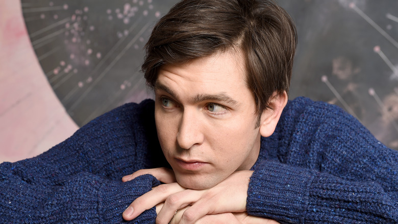 Nicholas Braun looking to side