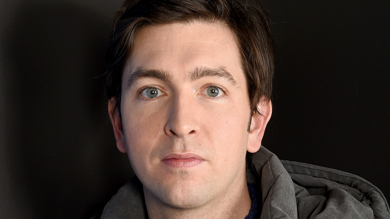 Nicholas Braun posing for cameras